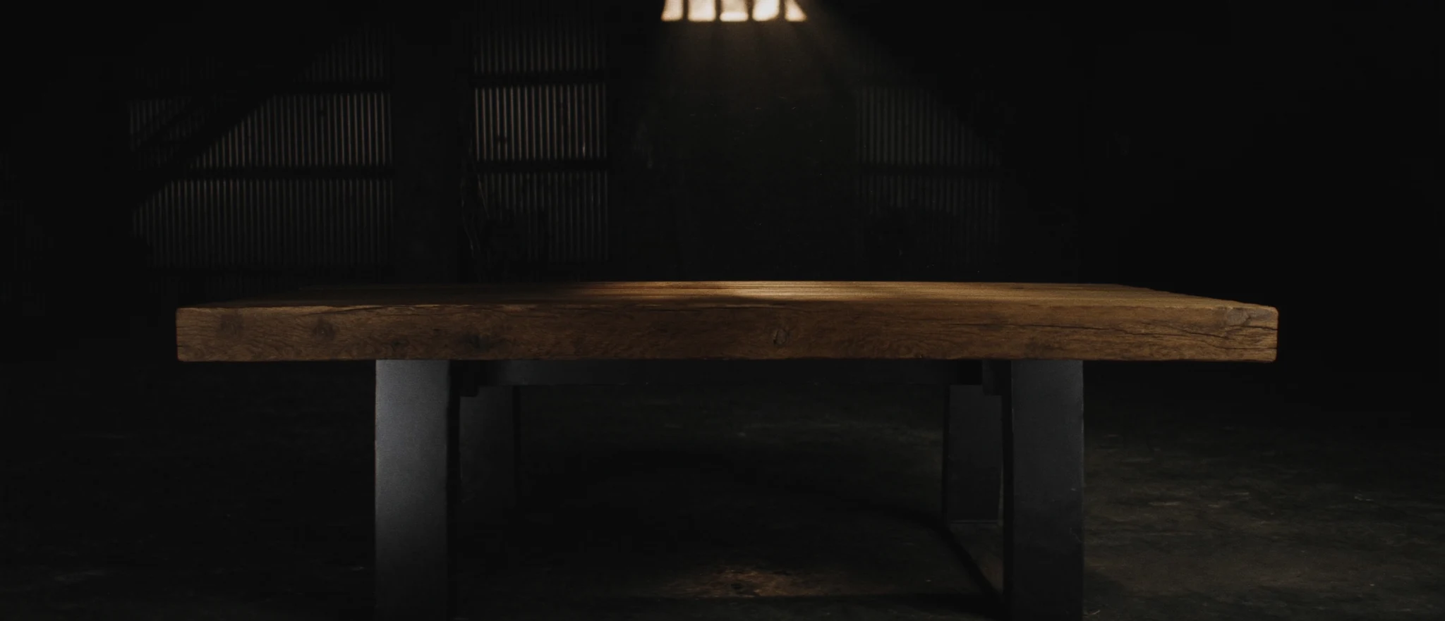 Concept image of a reclaimed wood table in a warm industrial interior